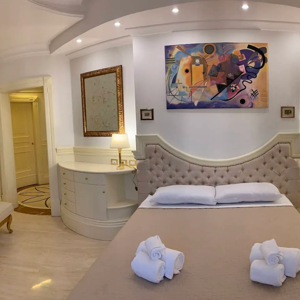 A room with artwork and golden details