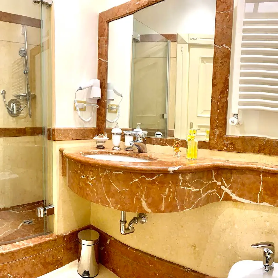 Marble bathroom with washbasin and mirror